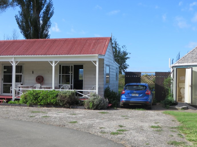 Cabin 6 on the left, our blue Ford Focus center, toilets on the right.